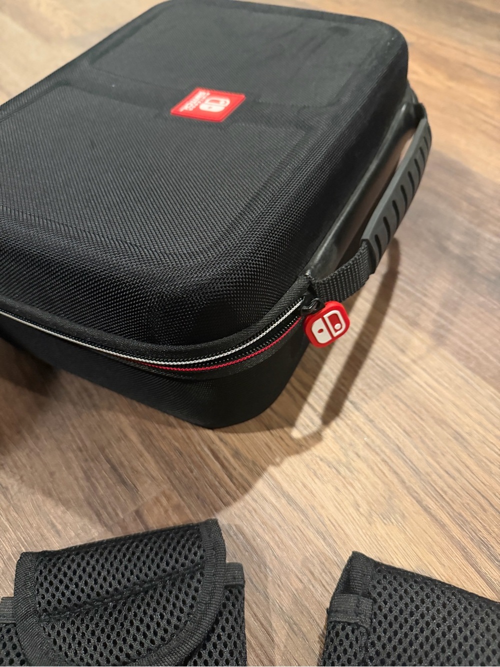 Nintendo Switch Black Carrying Case with Red Accents & accessories